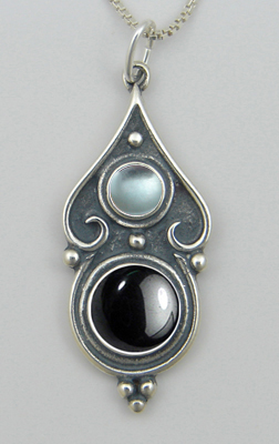 Sterling Silver Romantic Necklace in Hematite And Blue Topaz